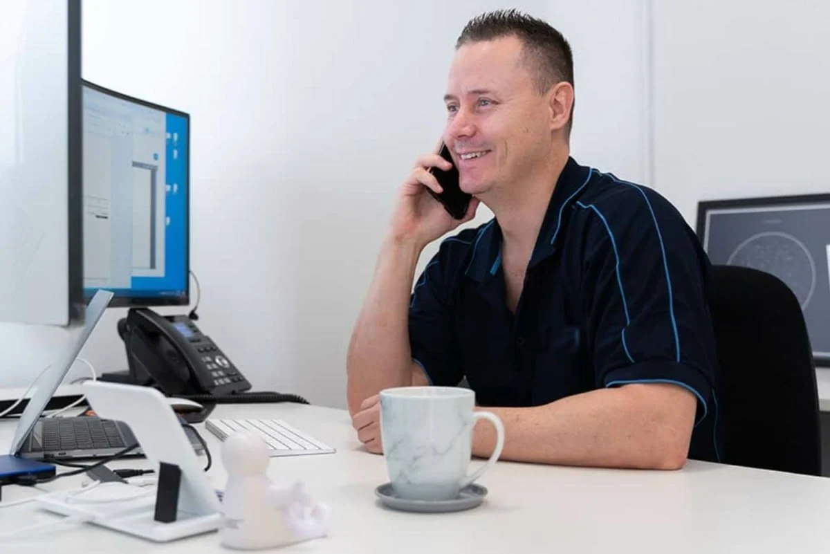 Frans du Plessis, Director at Mechanics Insurance, talking with a client